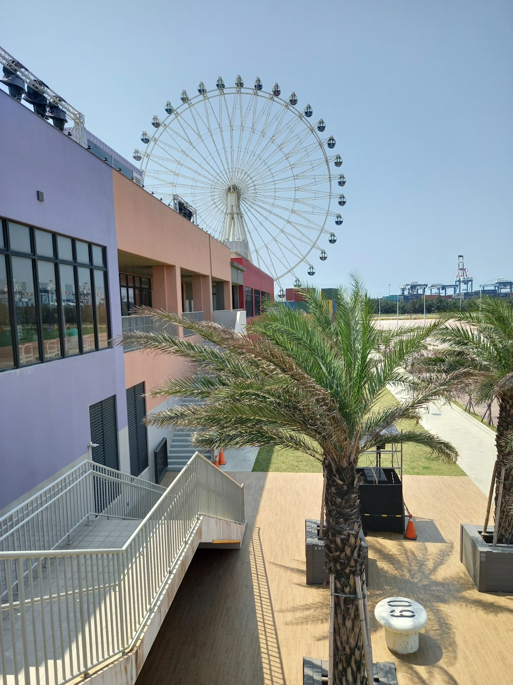 a ferris wheel next to a building