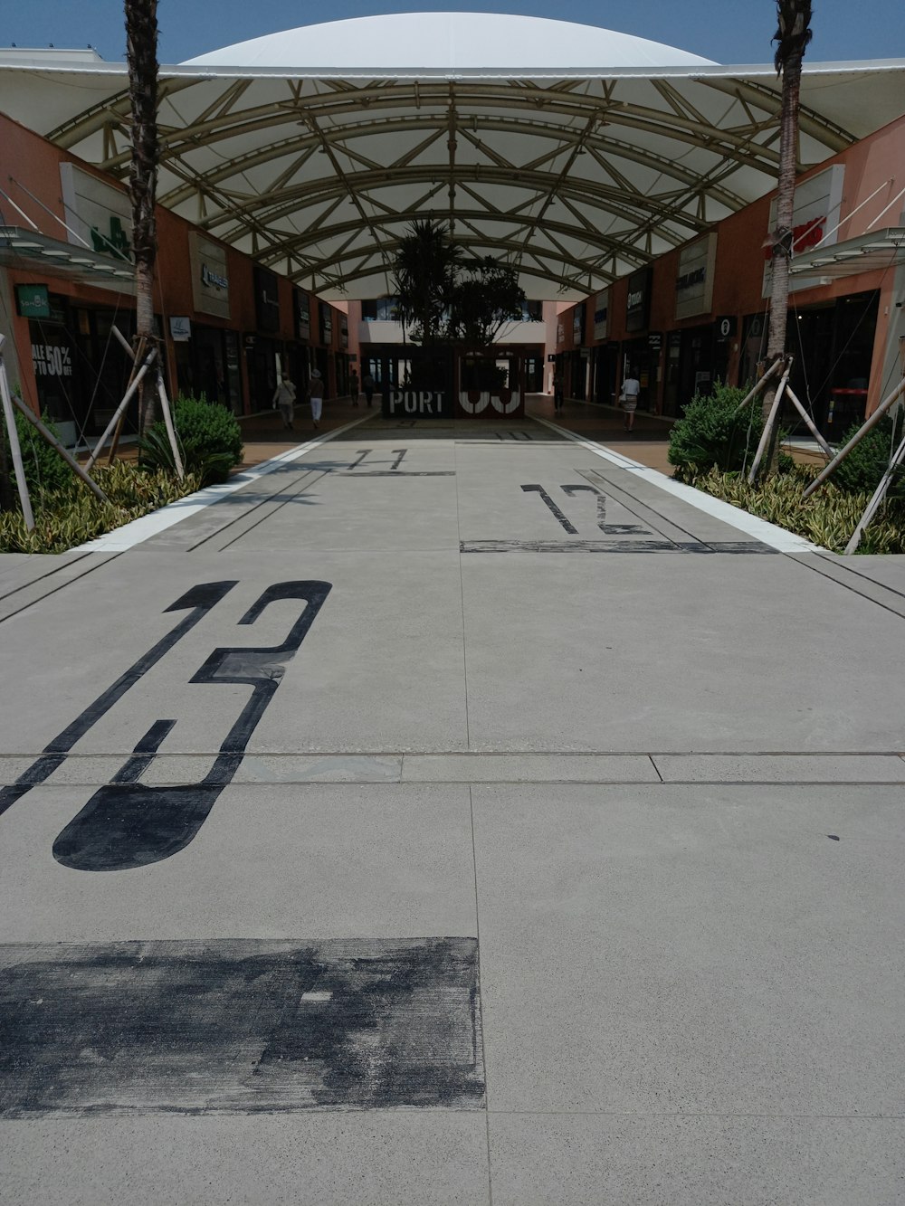 a paved area with a building in the background