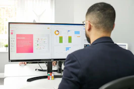 A lawyer reviewing website analytics on a laptop in a modern office.