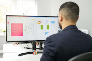A lawyer reviewing website analytics on a laptop in a modern office.