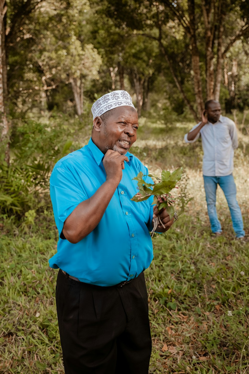 a man holding a plant