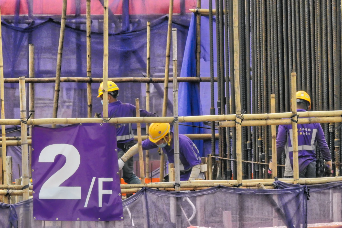 Construction workers on a jobsite in hard hats
