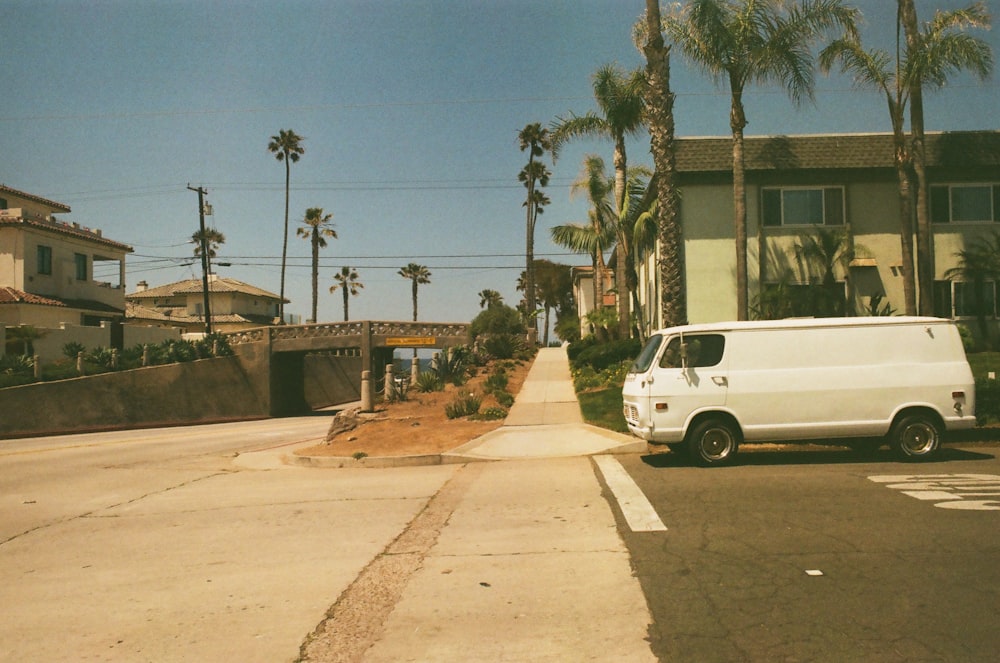 a white van parked on the side of a road