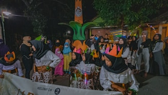 A group of children participating in a community cultural event outdoors.