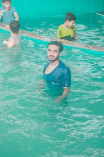 A group of friends enjoying a swim together in the spacious indoor pool.