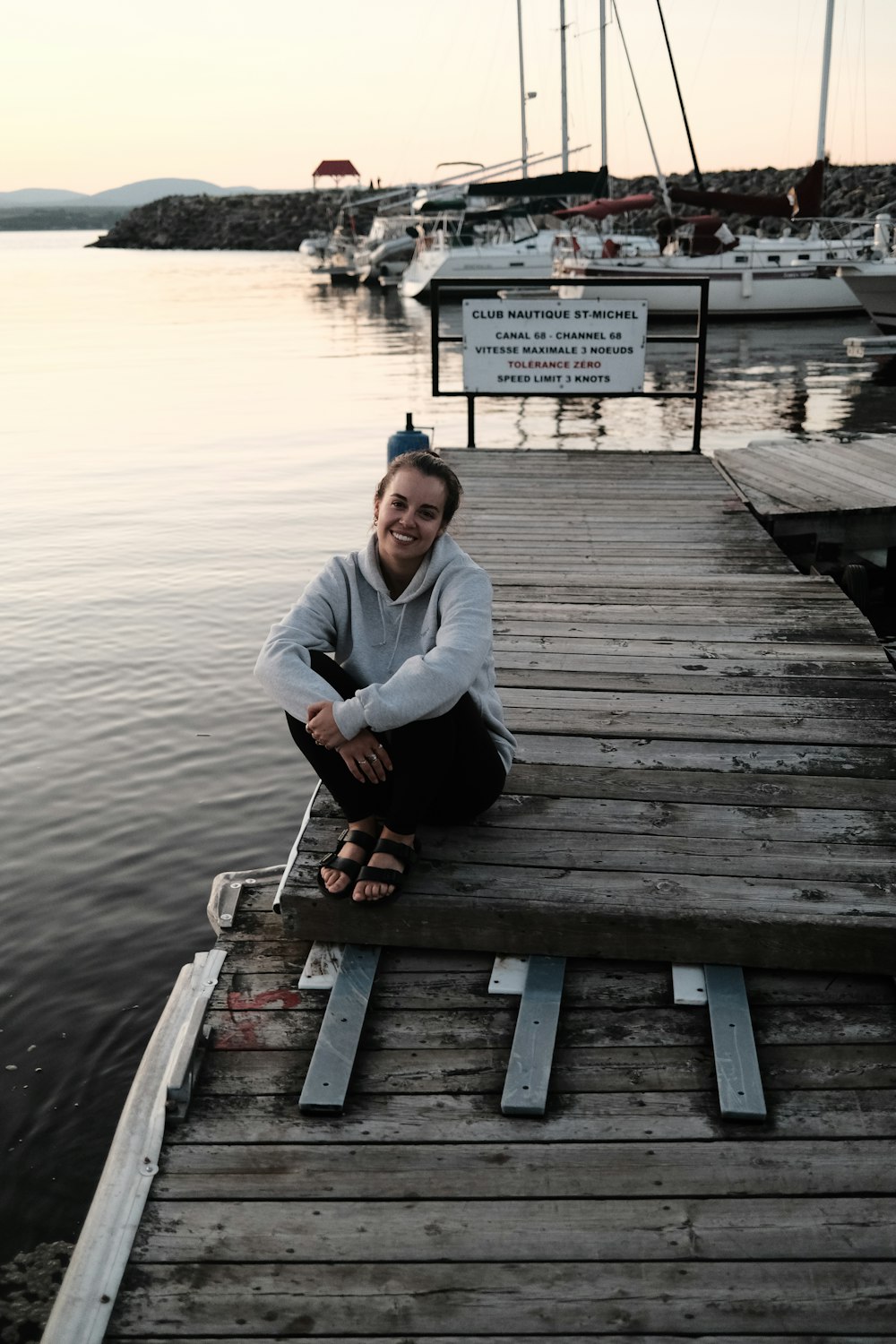 a person sitting on a dock