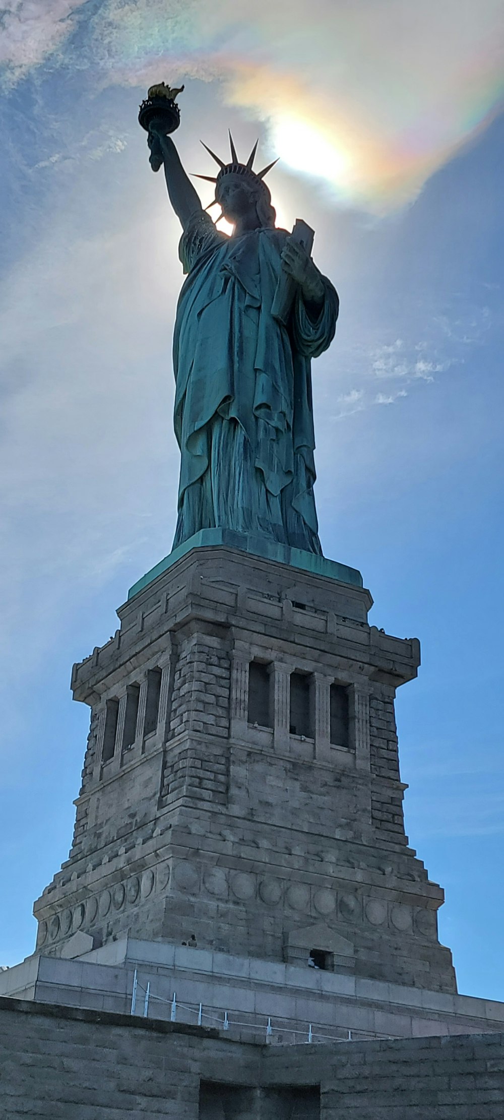 a statue of a person holding a torch