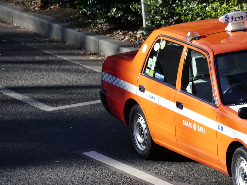 an orange van on a road