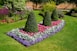 a garden with bushes and flowers