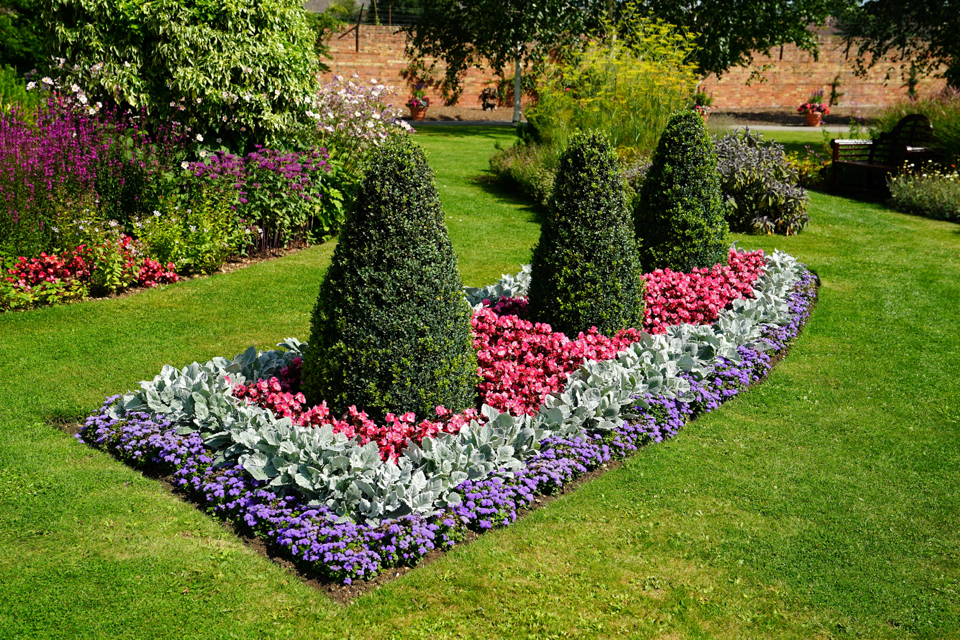 a garden with bushes and flowers