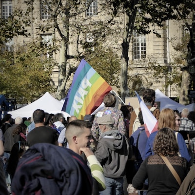 A peaceful rally advocating for cultural rights, with banners waving under a clear Swiss sky.