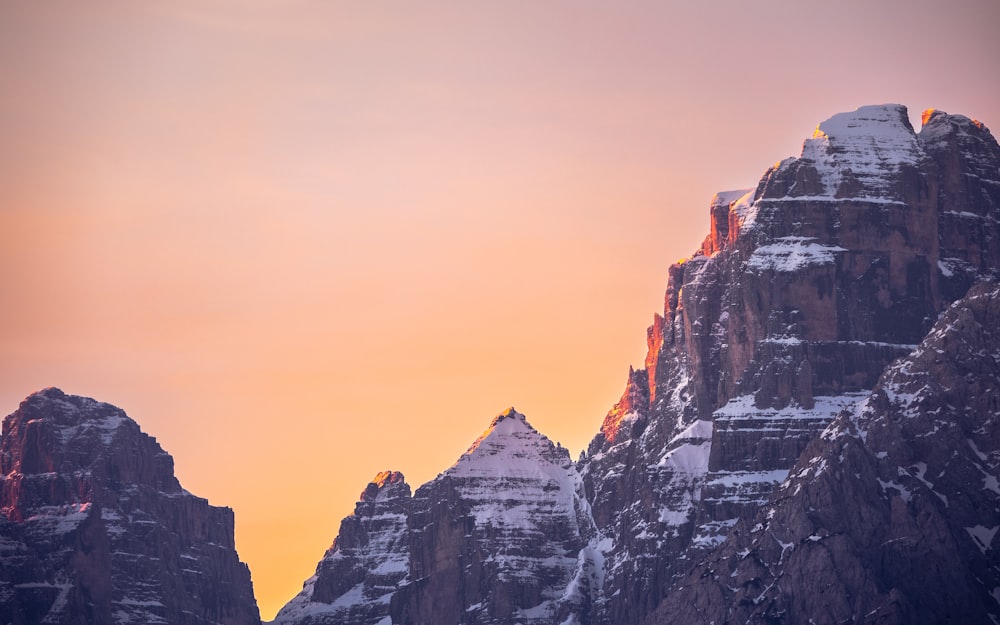 a rocky mountain with snow