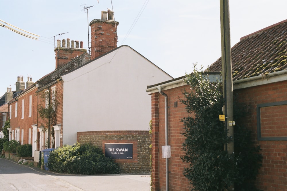 a brick building with a sign on it