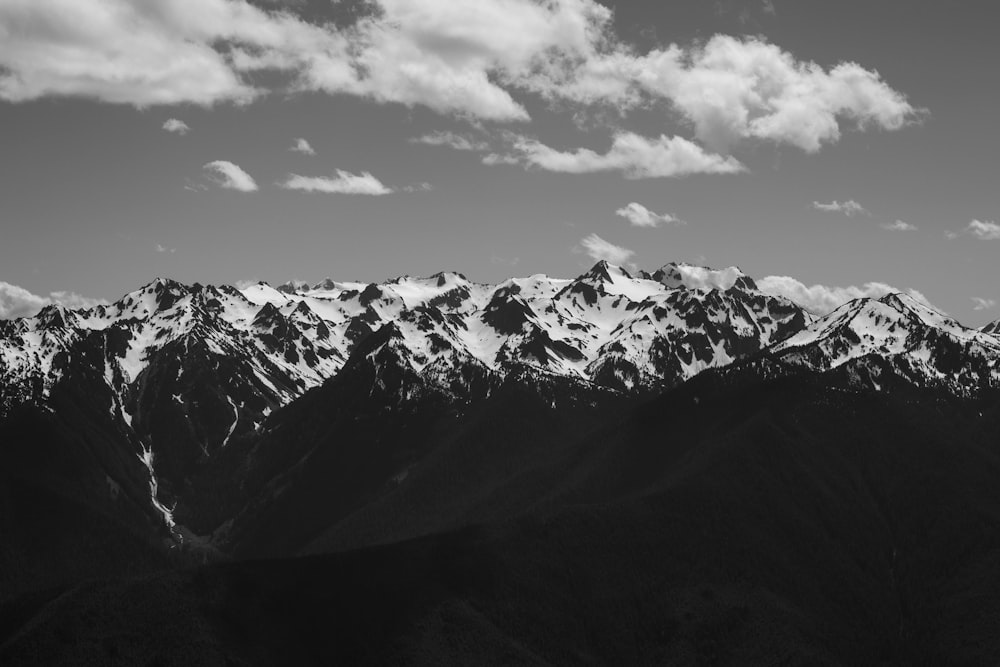 a mountain range with clouds