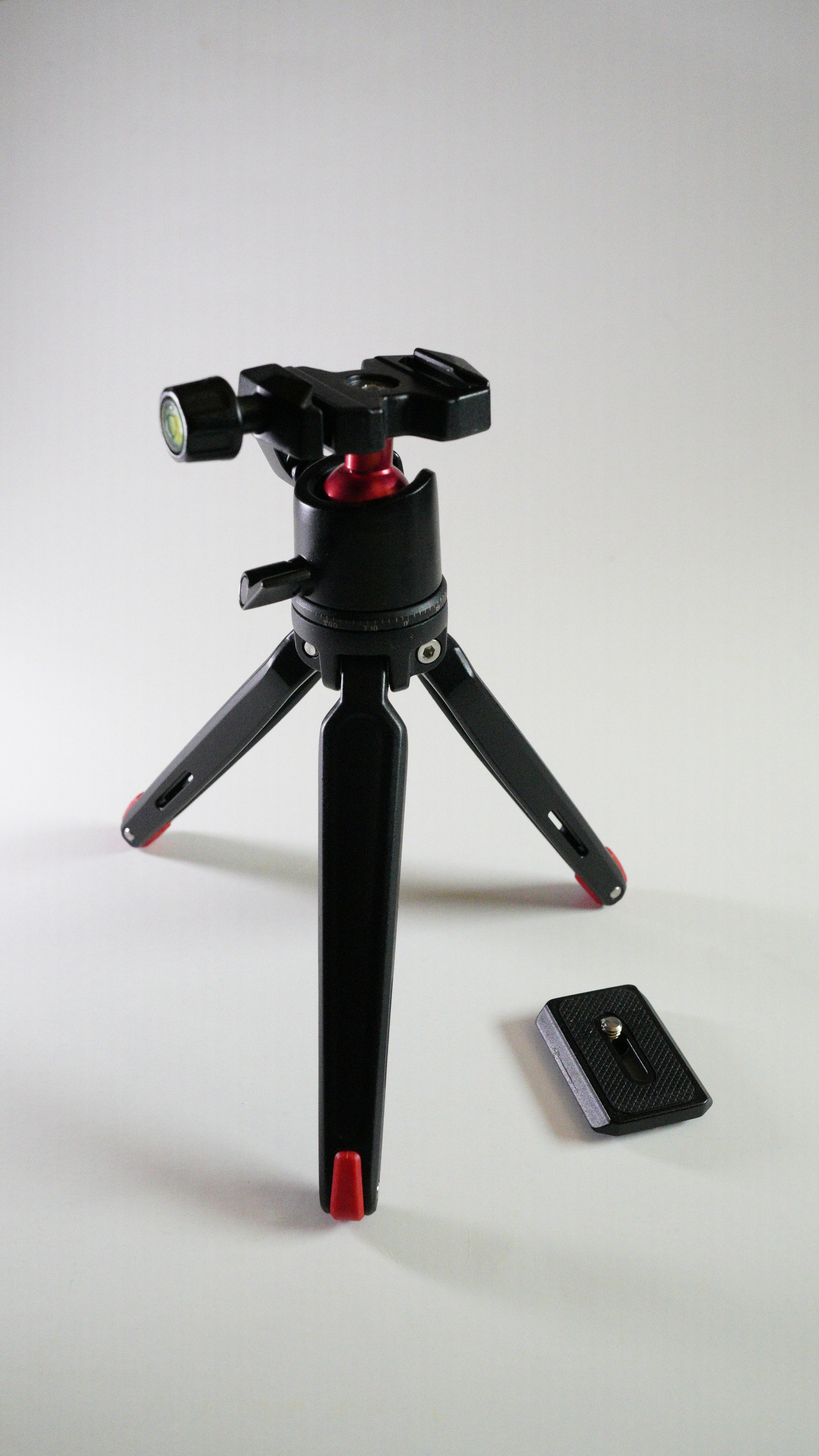 A professional DSLR camera on a tripod.