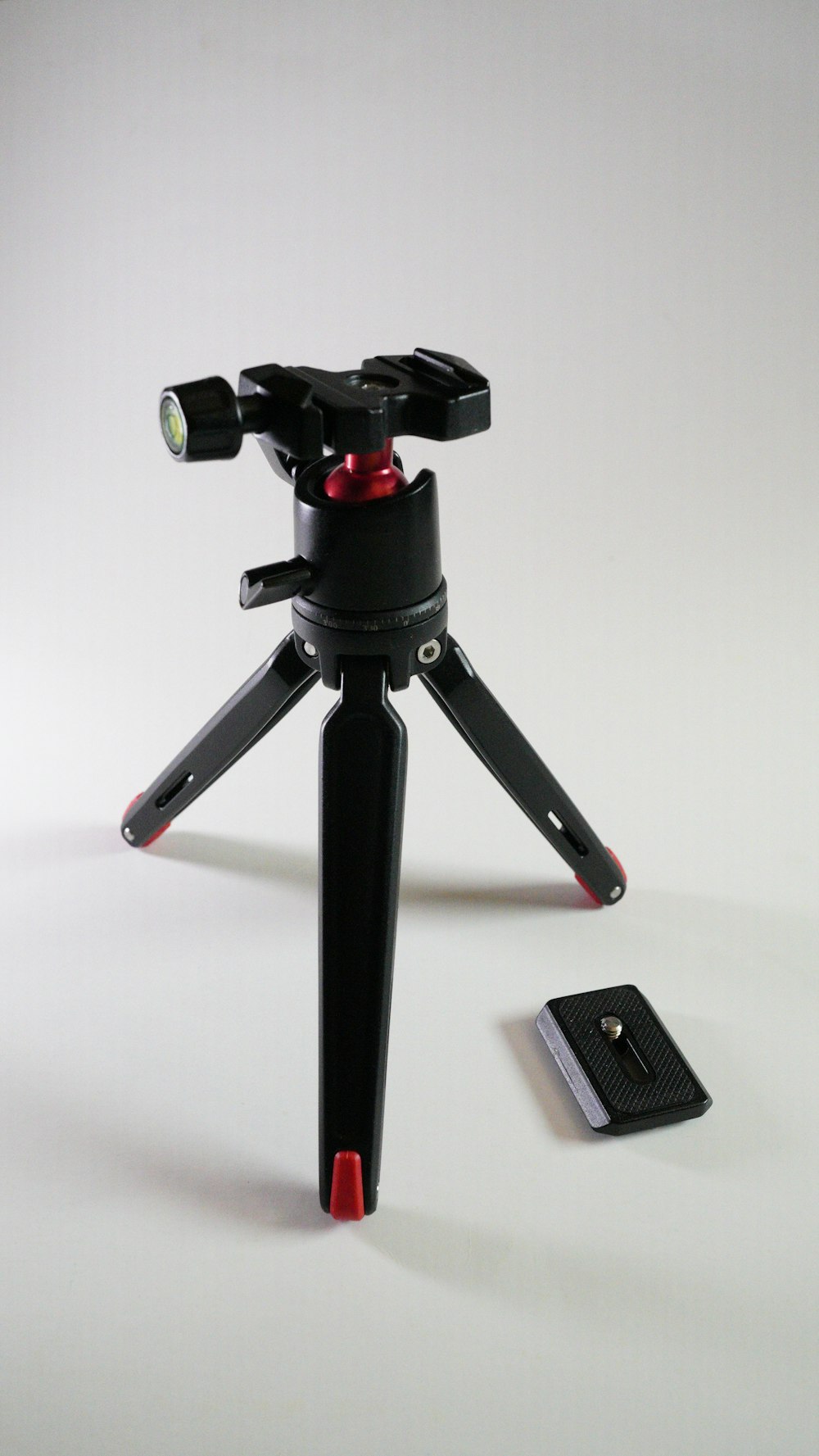 a black and red tripod