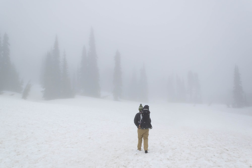 a man walking in the snow