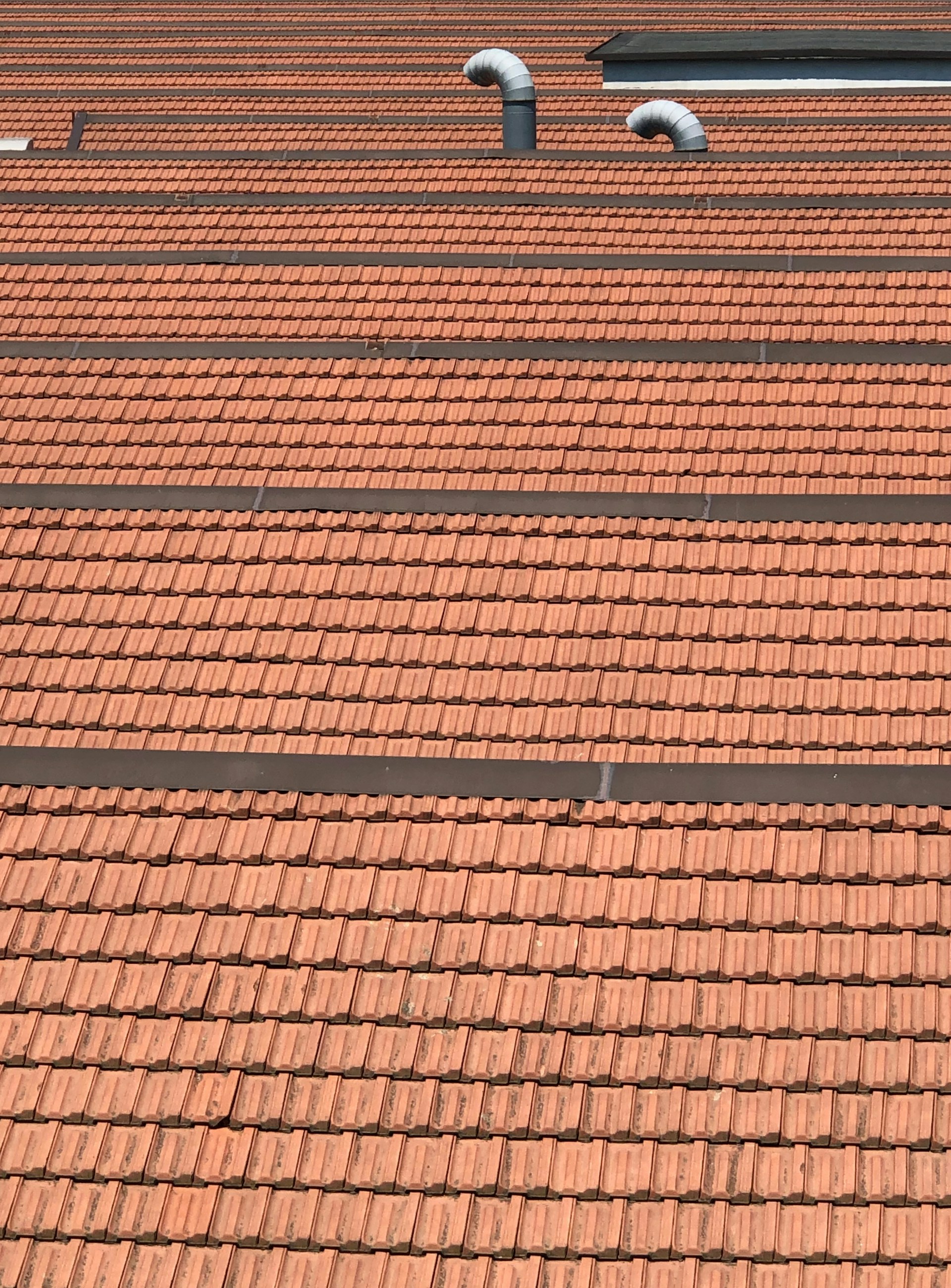 a brick walkway with a brick wall