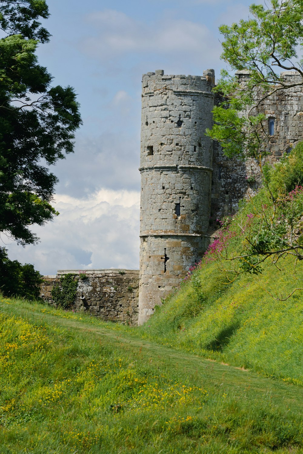 a stone castle on a hill