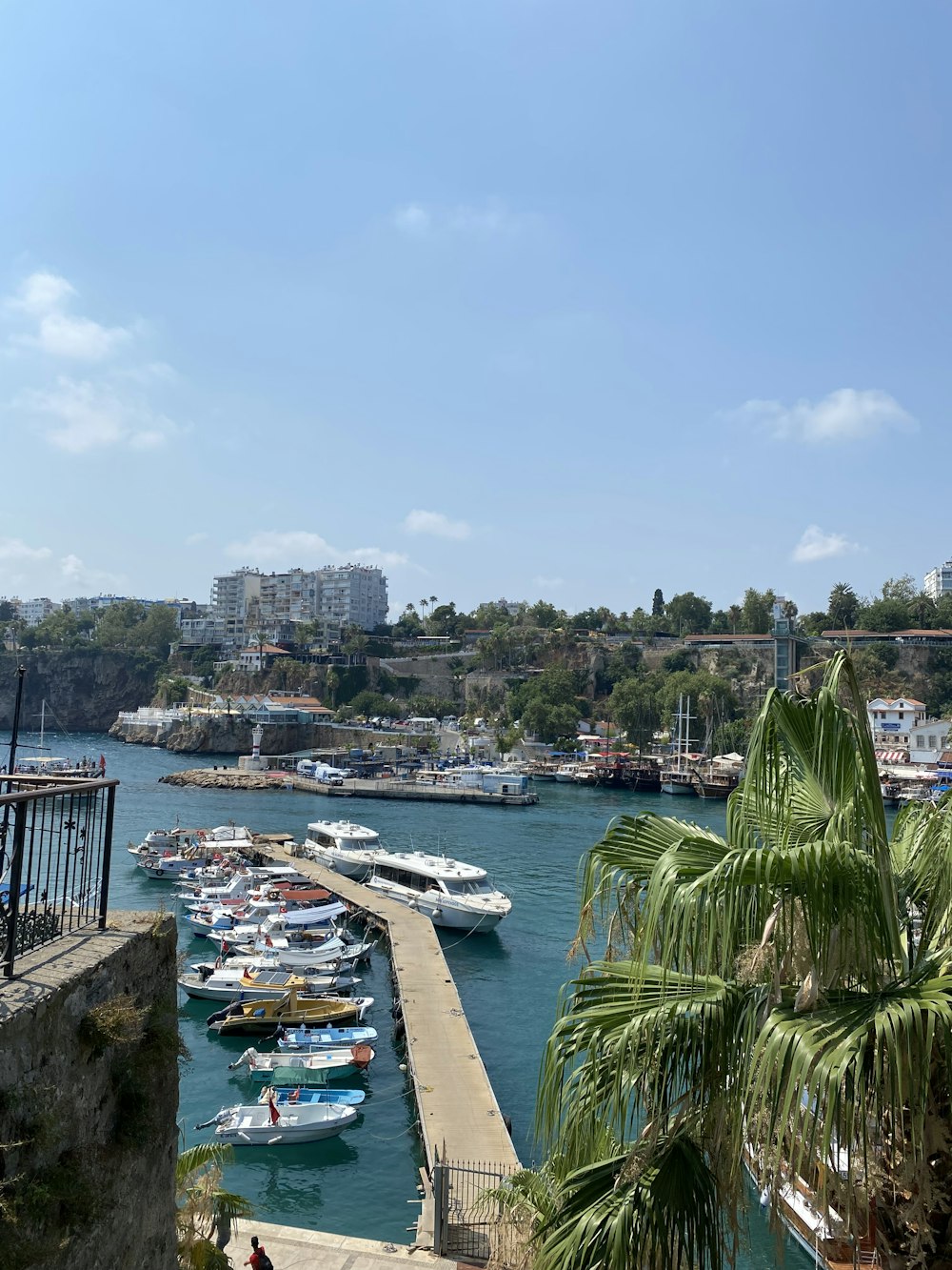 a body of water with boats on it and buildings in the back