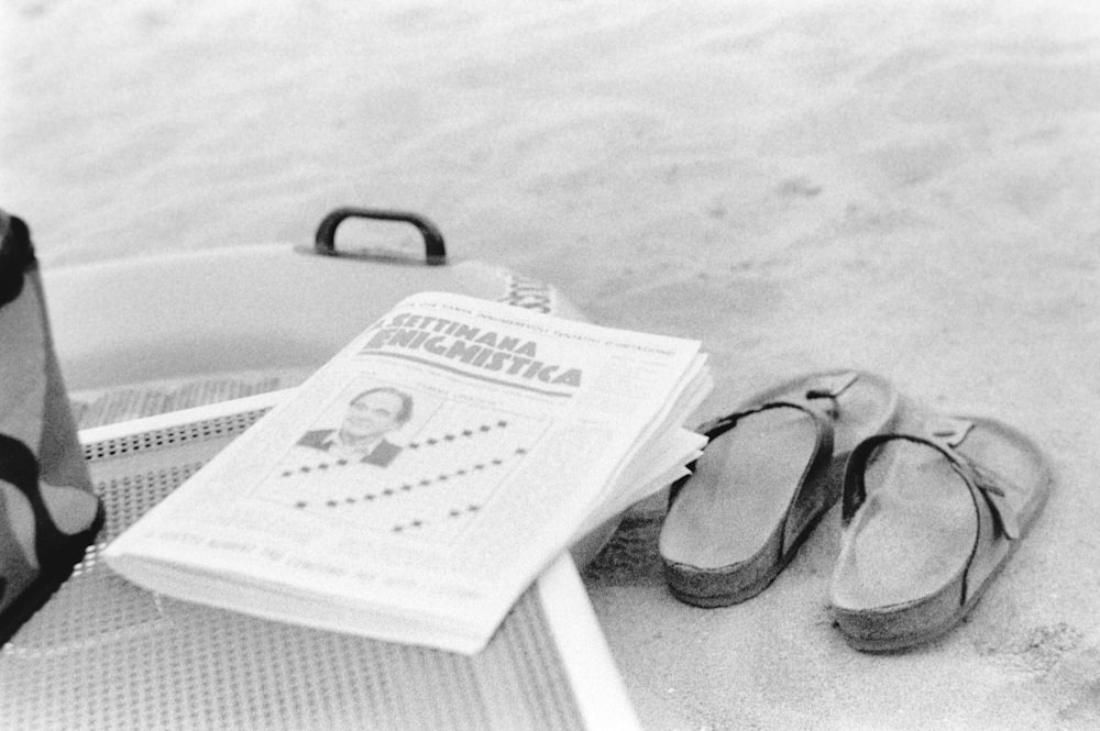 a pair of headphones and a book on a bed