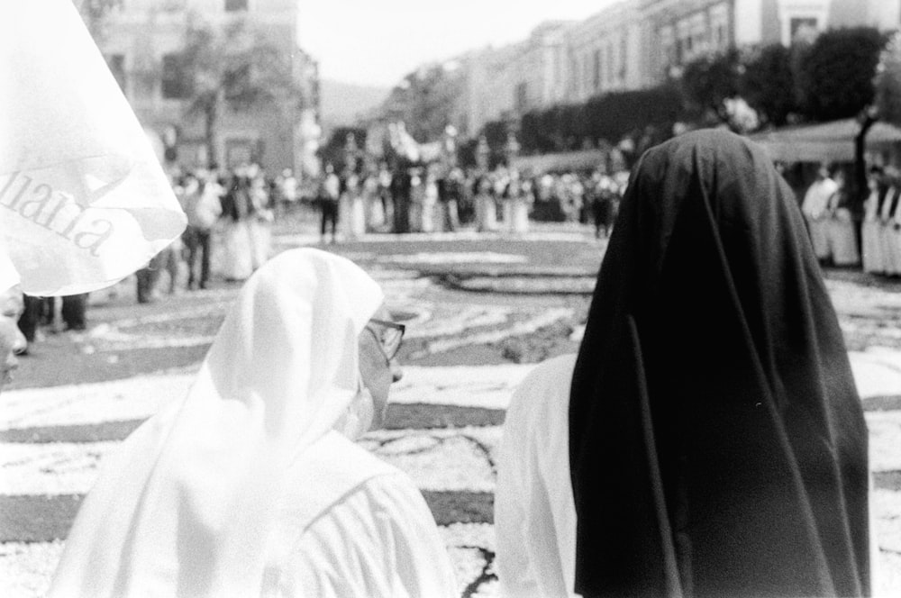 a group of people in black robes