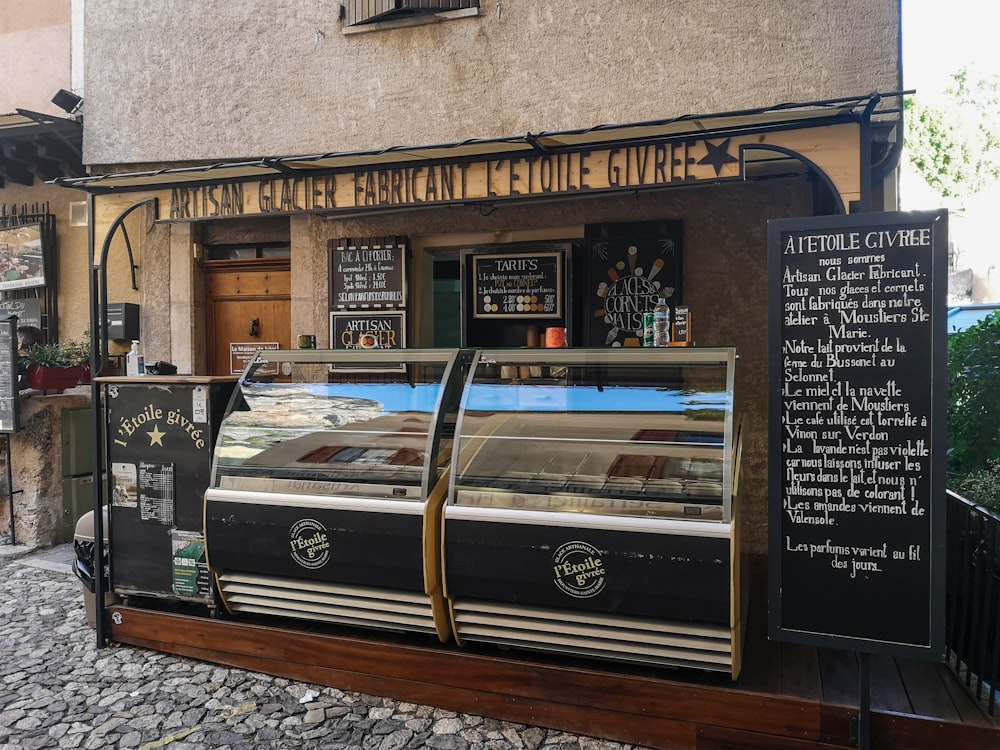 a small food stand outside of a building