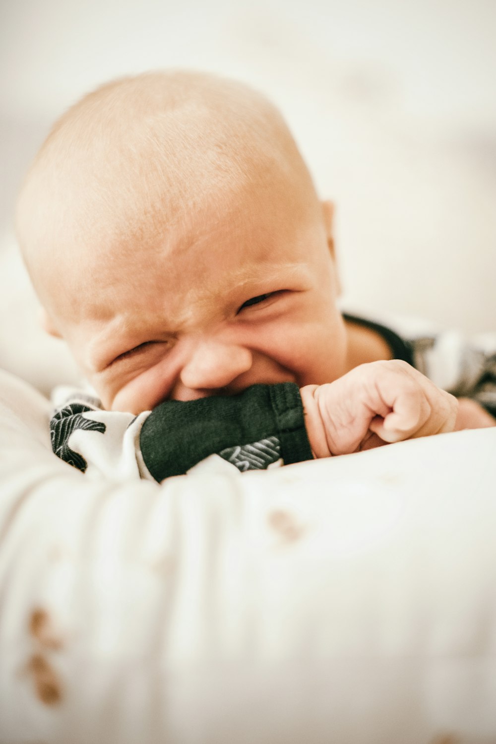 a baby sleeping on a blanket