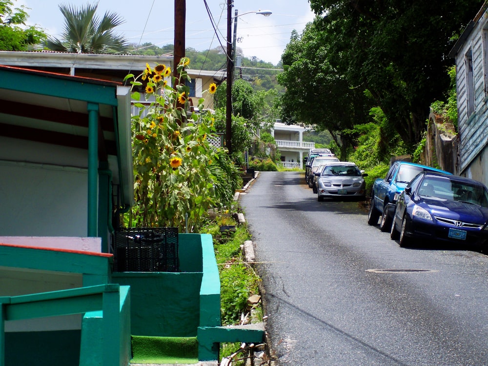 a row of cars parked on the side of a street