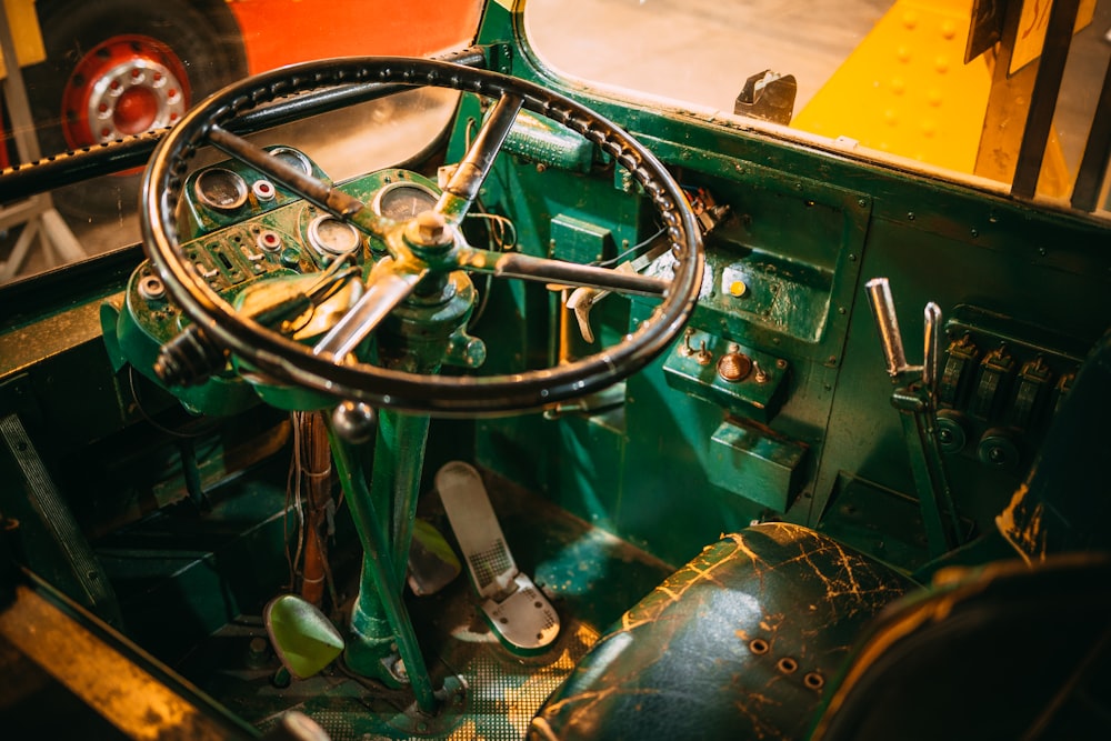 a green car with a large engine