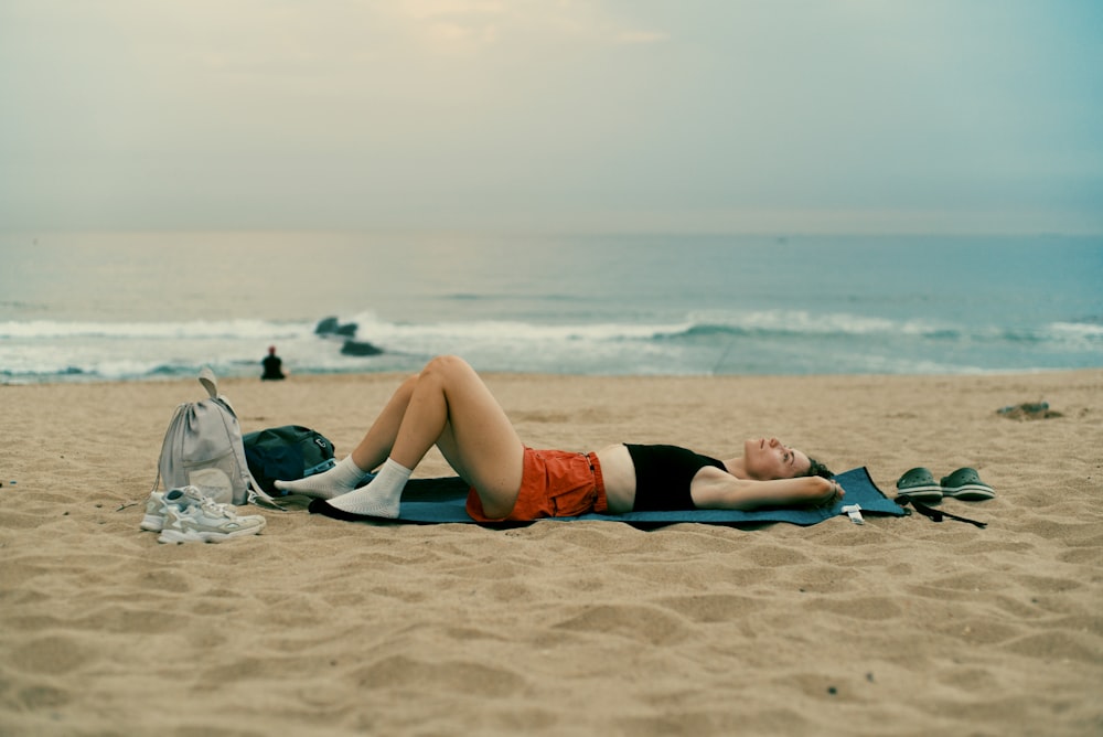 a person lying on a beach