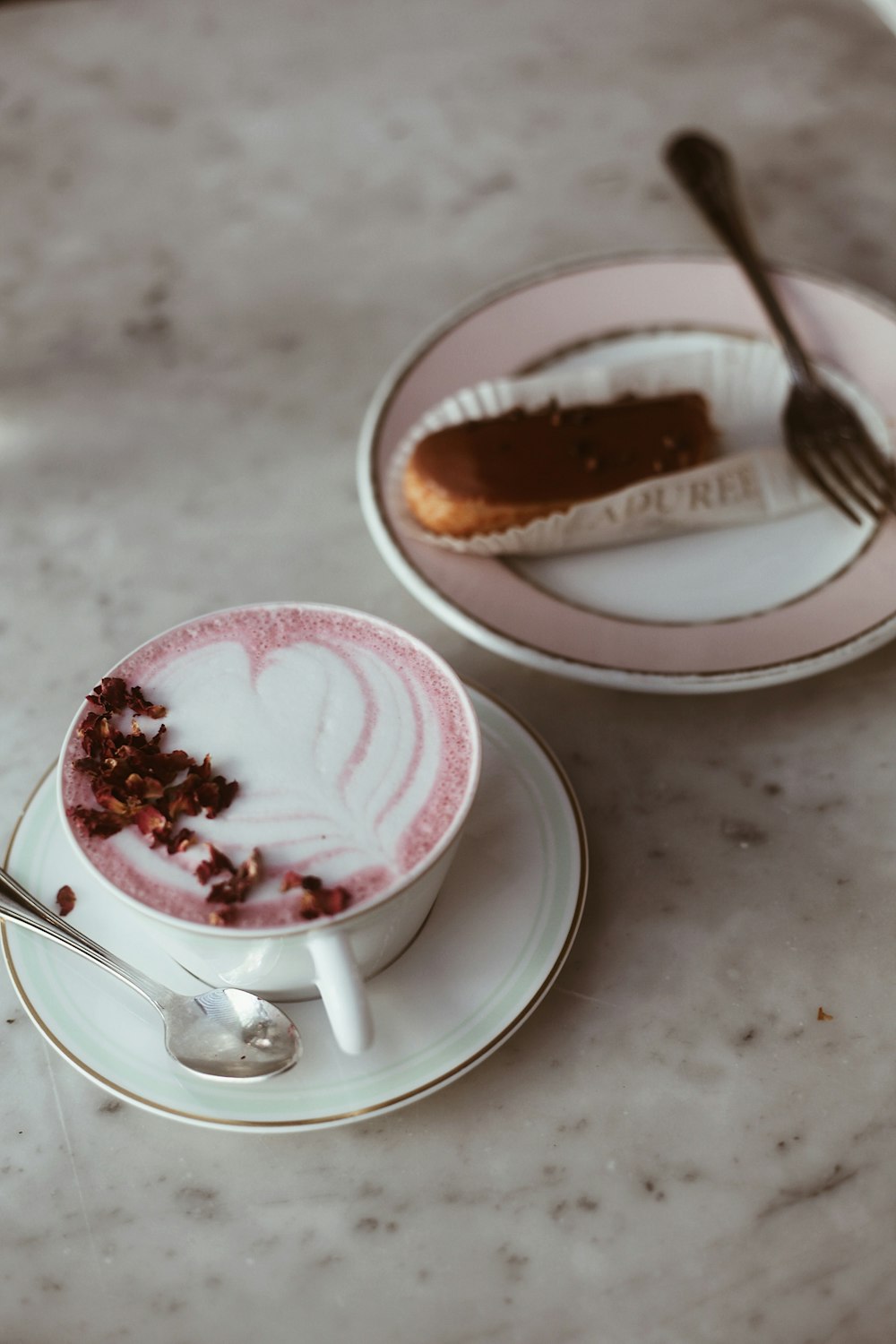 a couple of cups with brown liquid and chocolate in them