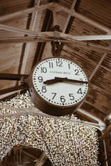 A cozy clock on a wall showing business hours in a welcoming environment.