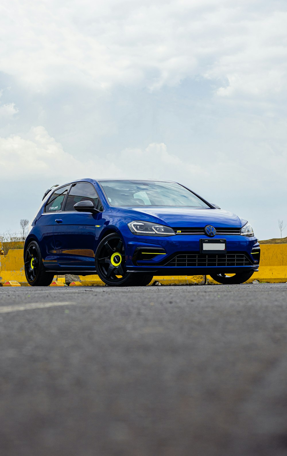 a blue car on a road