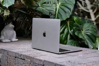 a laptop on a ledge