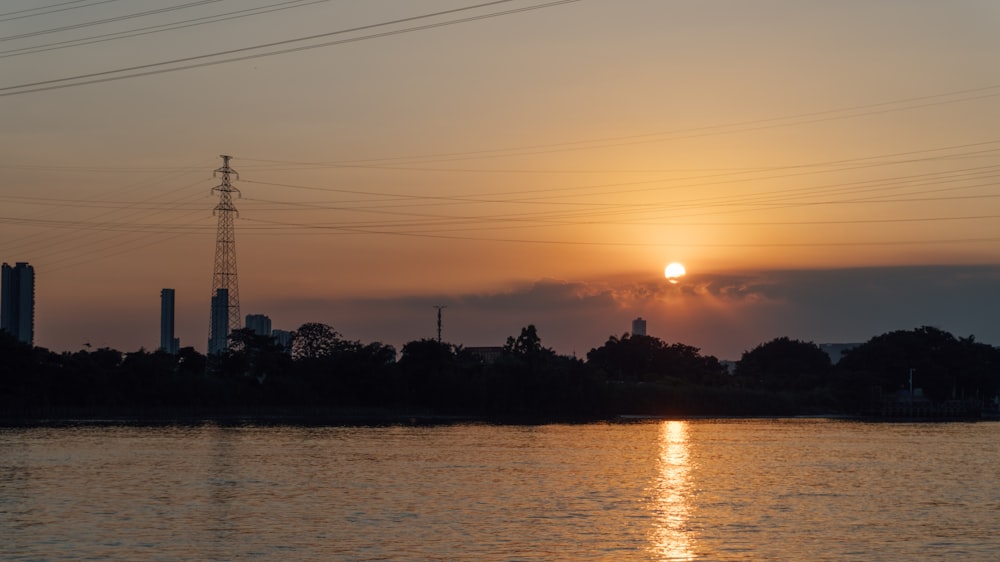 a body of water with a city in the background