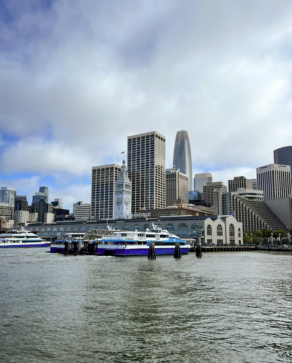 a city skyline with boats