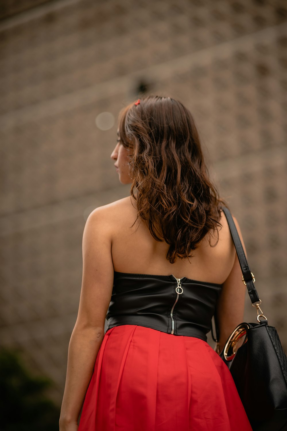a woman wearing a red skirt