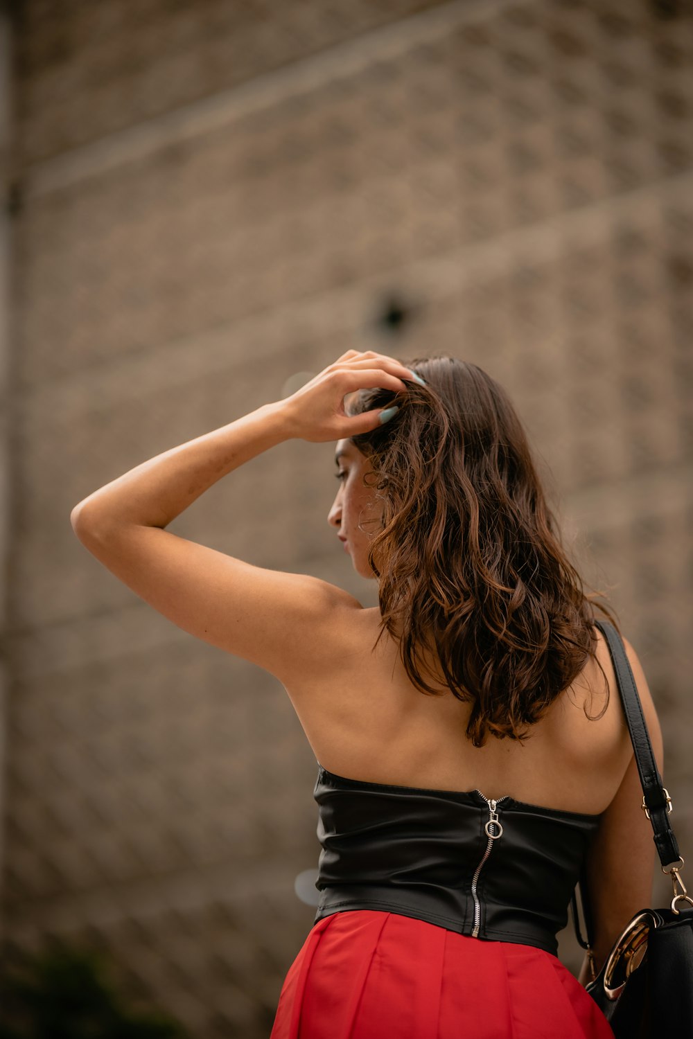 a woman with her hand on her head