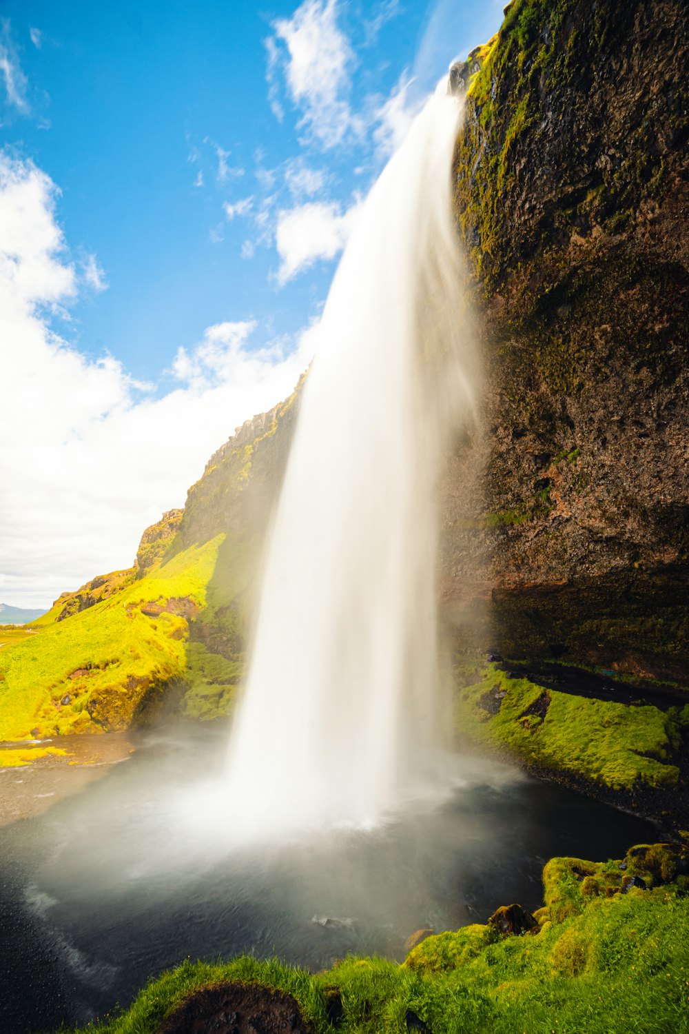 a waterfall in a valley