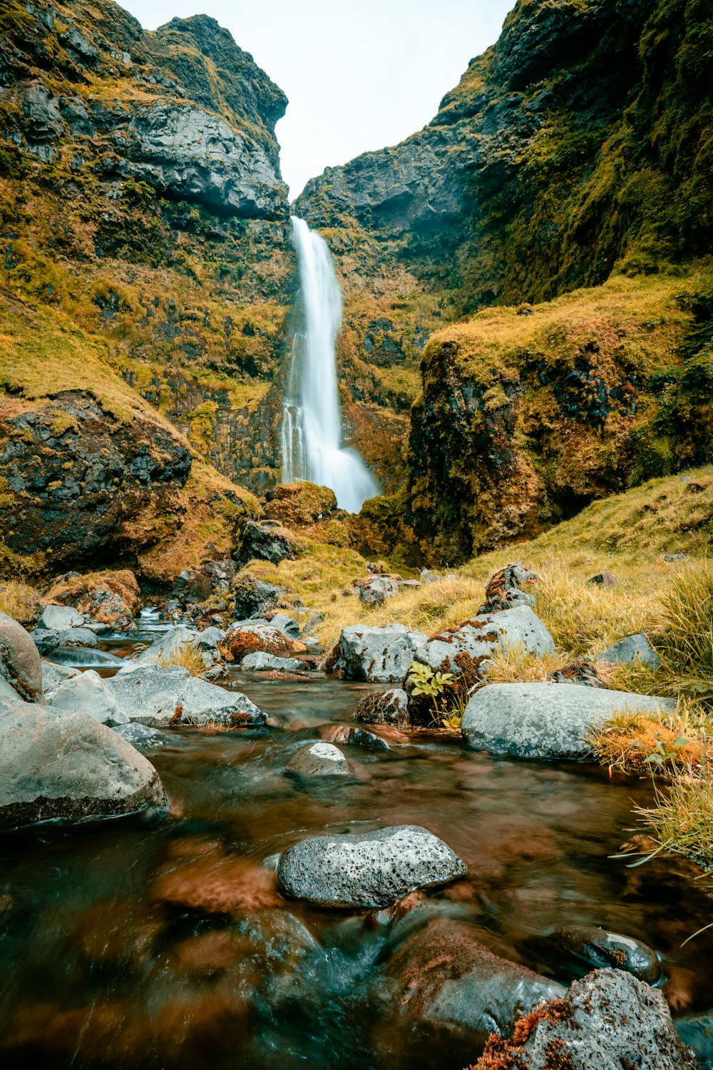 a waterfall in a rocky area