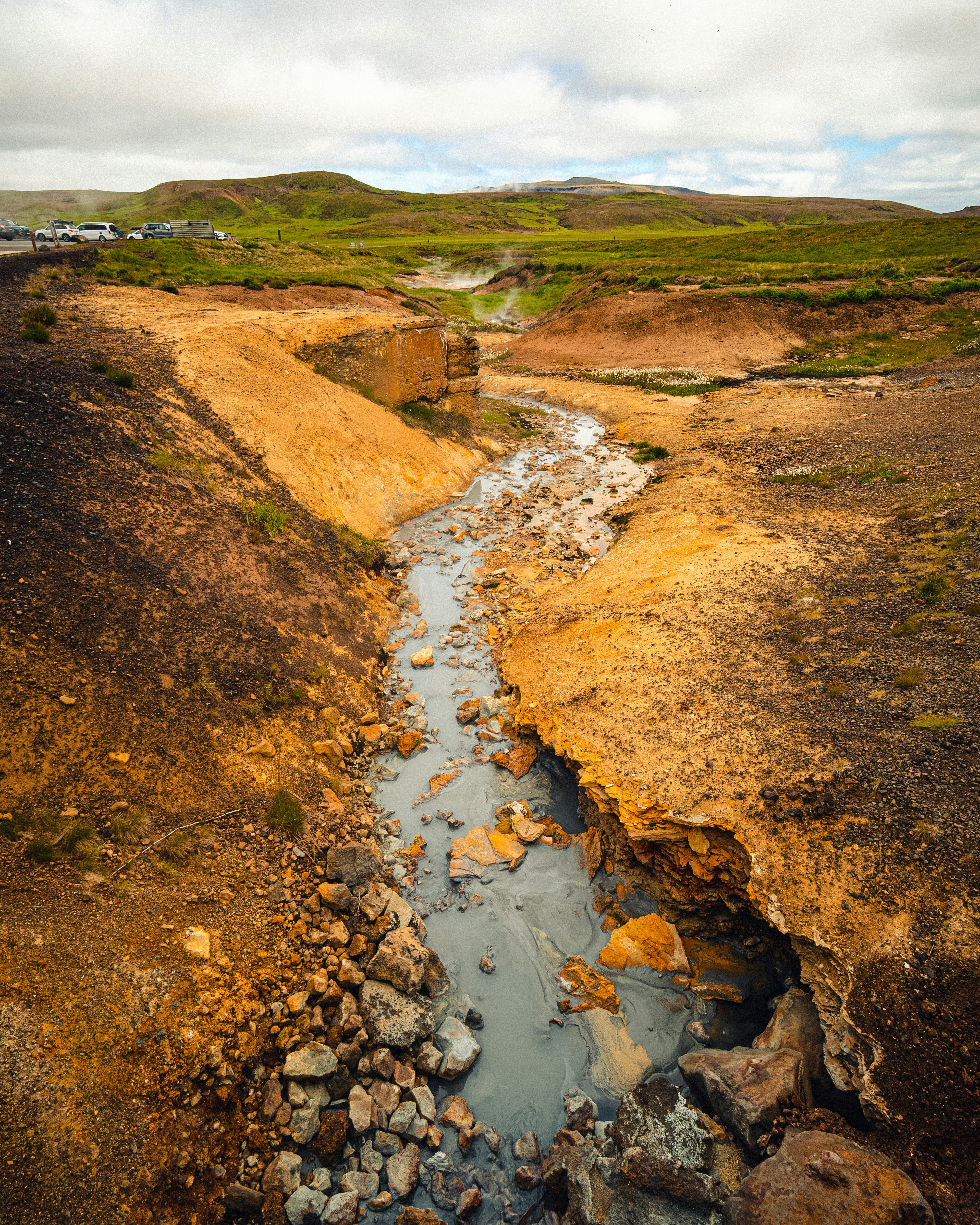 a stream of water running through a rocky area