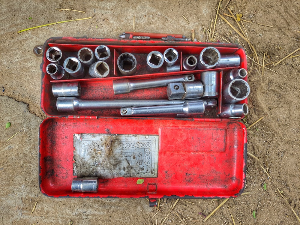 a red box with a couple of guns in it