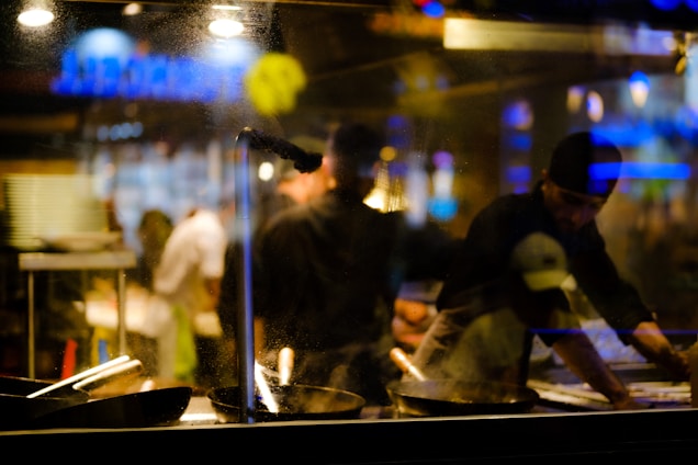 A vibrant Indian kitchen in Dubai showcasing chefs at work.
