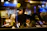 A warmly lit, modern UK restaurant kitchen bustling with focused chefs at work.