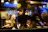 A warmly lit, modern UK restaurant kitchen bustling with focused chefs at work.
