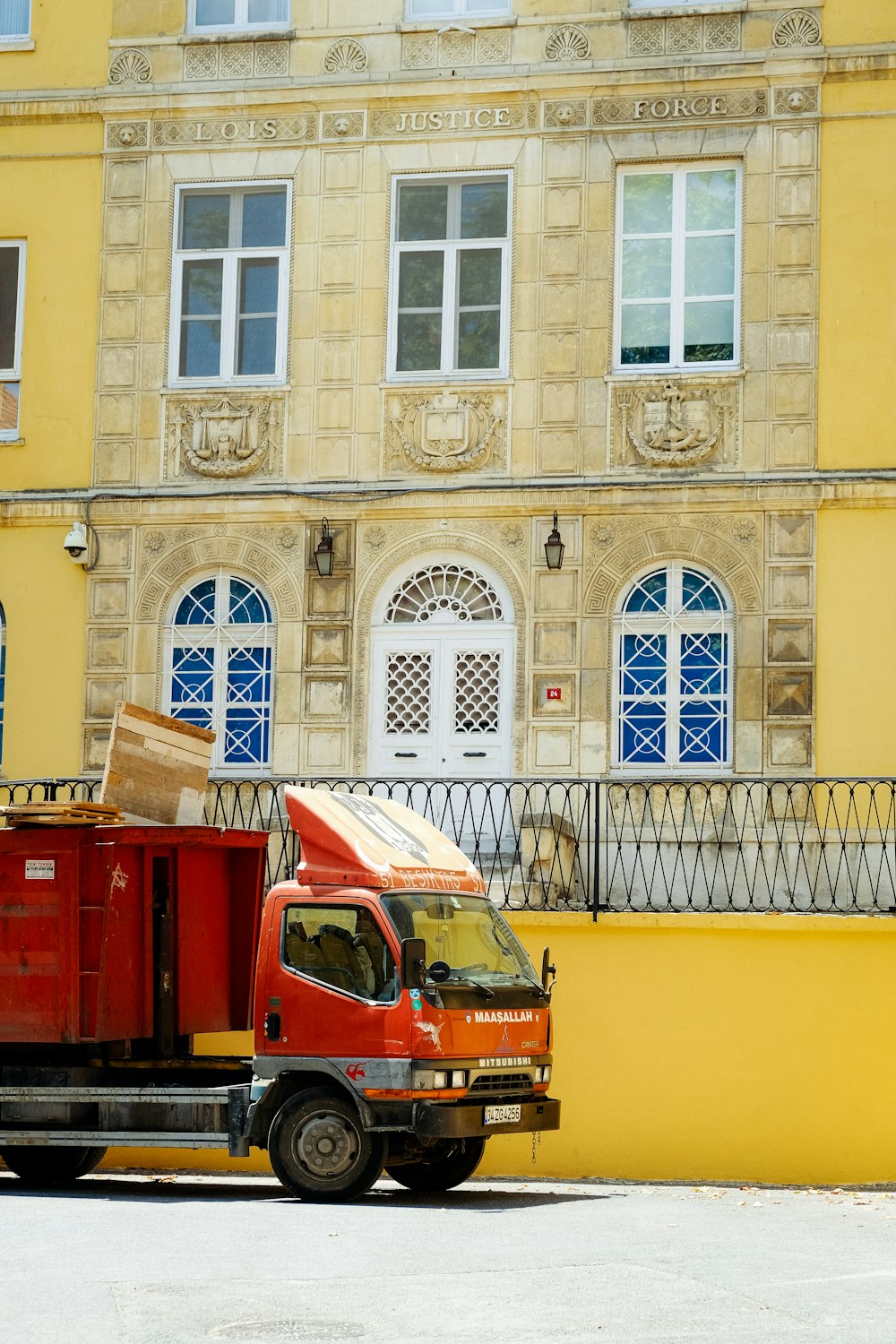 a truck parked in front of a building