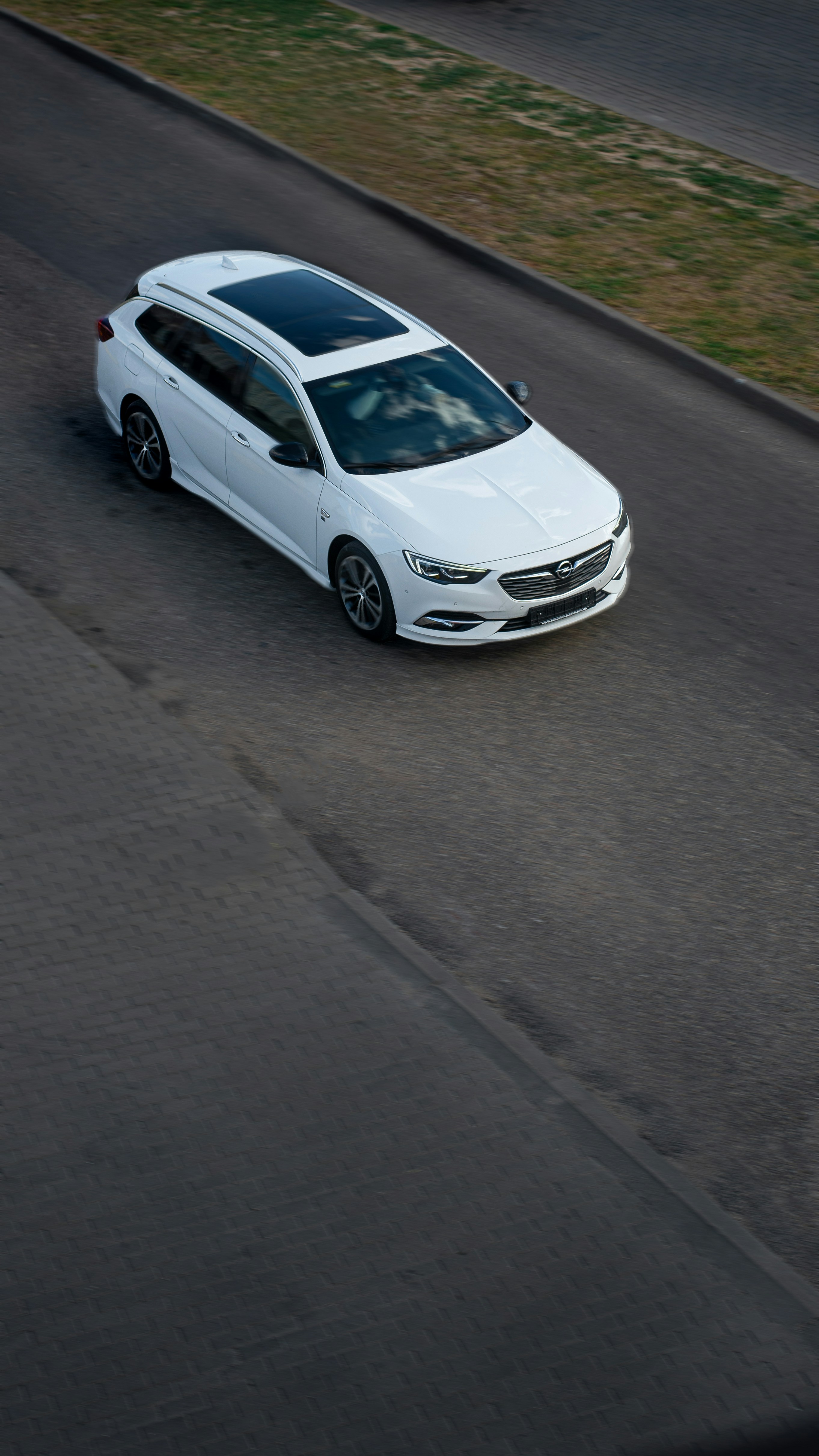 a white car parked on a road