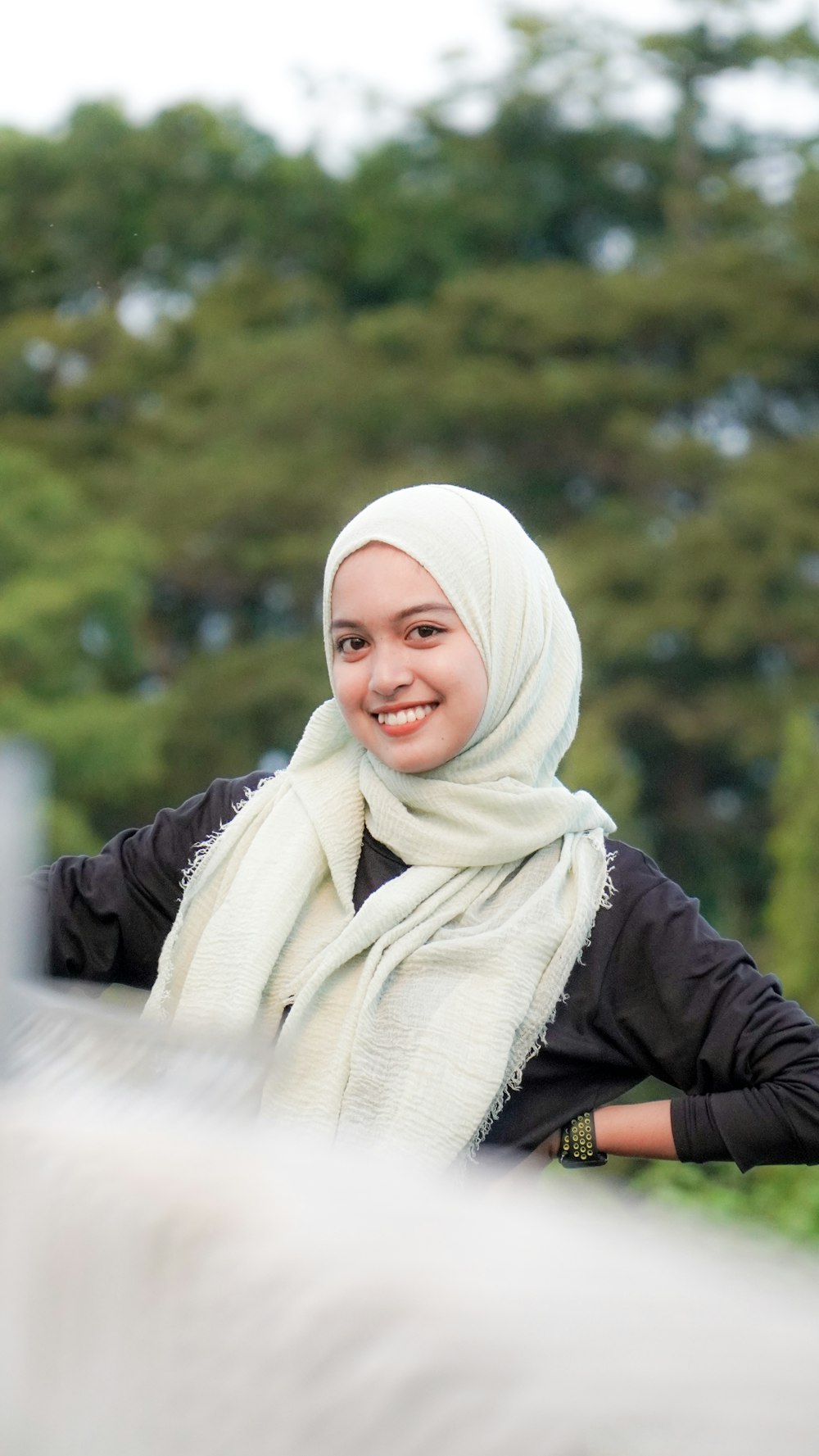 a woman wearing a white head scarf