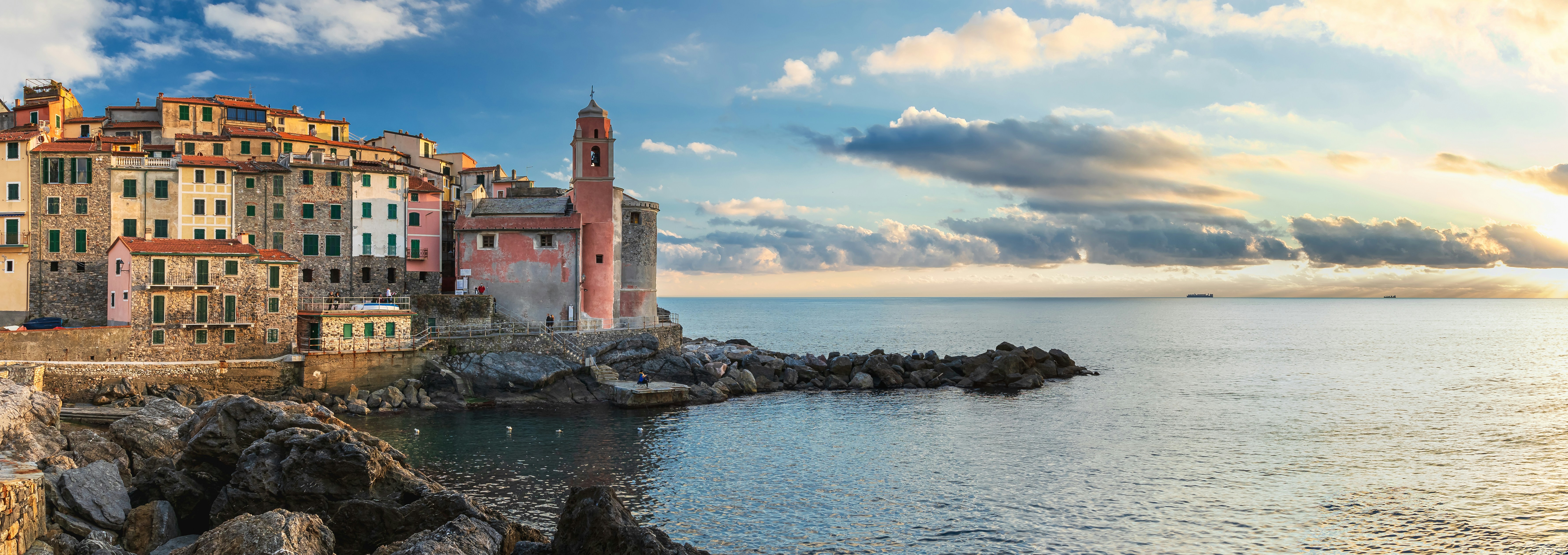 a group of buildings next to a body of water